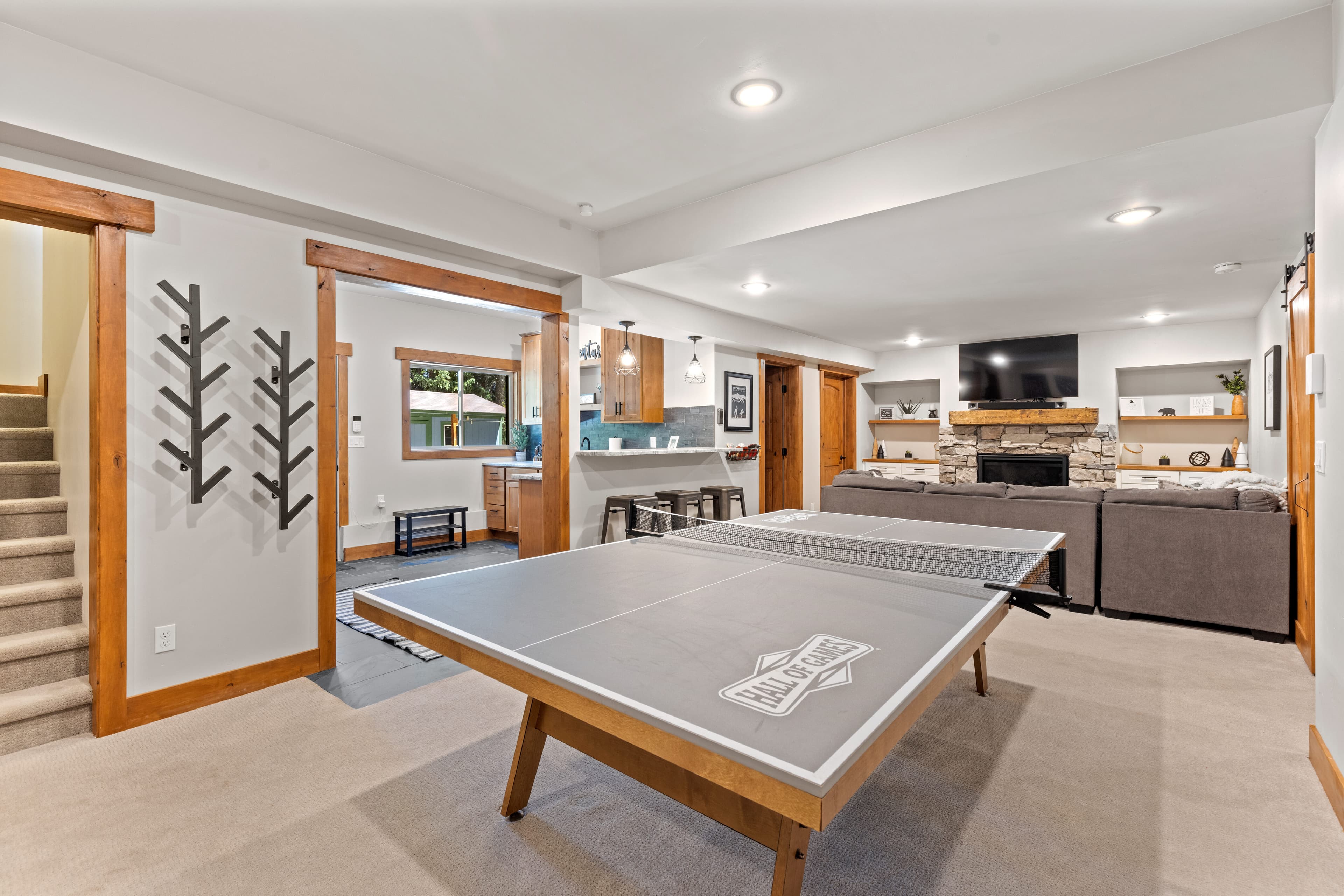 Basement living area with ping pong table
